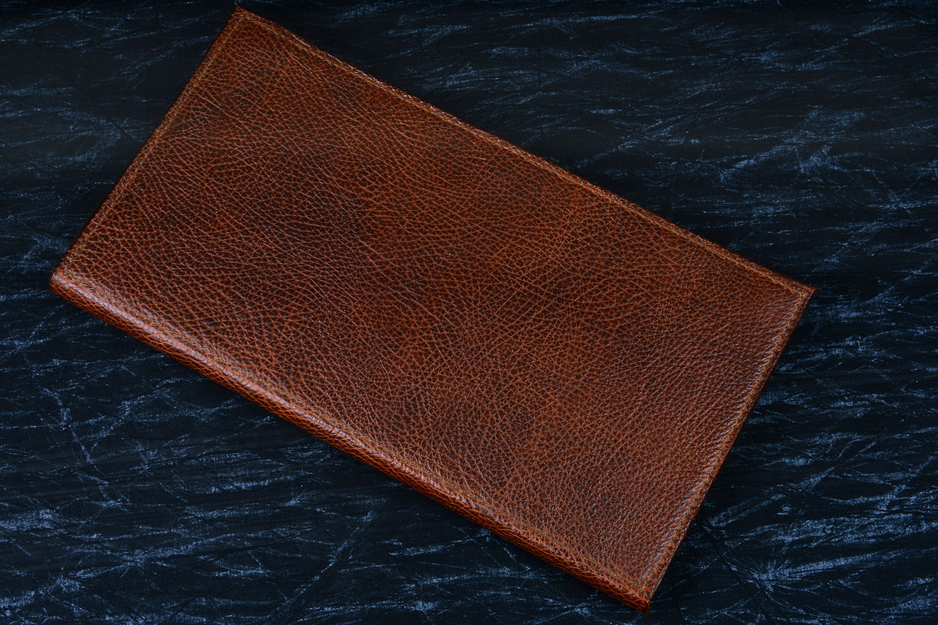 "Bordeaux, Courbe Vaste, Thresher" fine handmade chef's knives, BBQ knives, book case view in Bison (American Buffalo), leather shoulder, nylon stitching, stainless steel snap fasteners book case