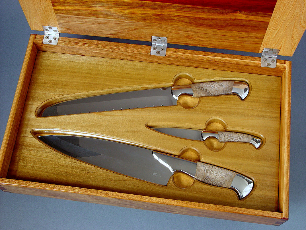 "Chef's Set" obverse side view in CPM154CM stainless steel blades, 304 stainless steel bolsters, Petrified Palm Wood gemstone handles, case of Pecan, Arririba, Padauk, Bloodwood, Bocote, Poplar, stainless steel "Chef's Set" obverse side view in CPM154CM stainless steel blades, 304 stainless steel bolsters, Petrified Palm Wood gemstone handles, case of Pecan, Arririba, Padauk, Bloodwood, Bocote, Poplar, stainless steel