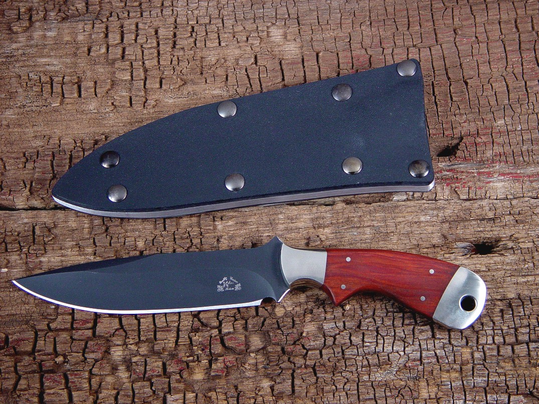 The "Creature" in bead blasted and hot blued O-1 high carbon tungsten-vanadium tool steel blade, 304 stainless steel bolsters, Redheart hardwood handle, kydex, aluminum, blued steel sheath The "Creature" in bead blasted and hot blued O-1 high carbon tungsten-vanadium tool steel blade, 304 stainless steel bolsters, Redheart hardwood handle, kydex, aluminum, blued steel sheath