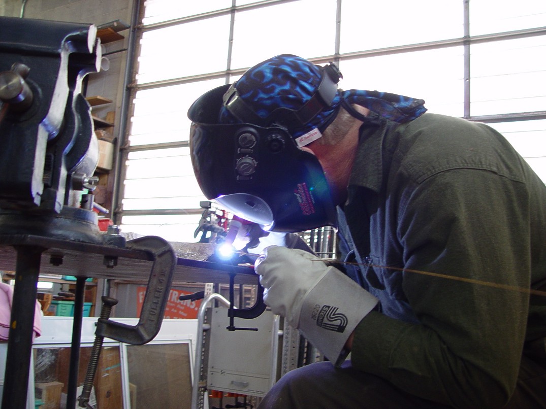 Gas tungsten arc welding in high tech modern art studio and machine shop Gas tungsten arc welding in high tech modern art studio and machine shop