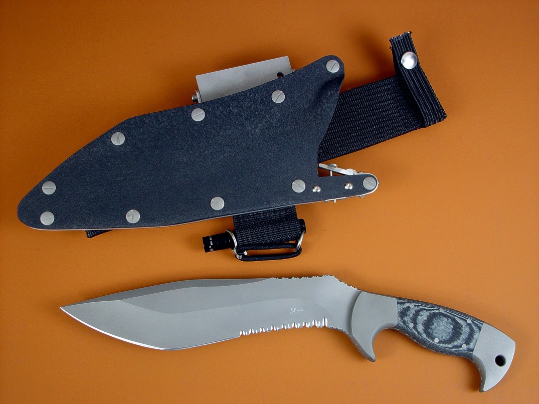 "Kneph" obverse side view in ATS-34 high molybdenum stainless steel blade, 304 stainles steel bolsters, Black and gray G10 fiberglass epoxy composite handle, locking kydex, aluminum, stainles steel sheath with full accessory package "Kneph" obverse side view in ATS-34 high molybdenum stainless steel blade, 304 stainles steel bolsters, Black and gray G10 fiberglass epoxy composite handle, locking kydex, aluminum, stainles steel sheath with full accessory package
