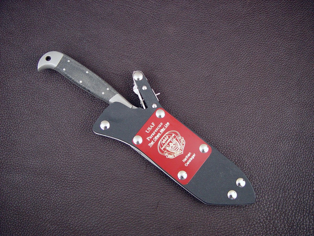 "PJLT" Tactical Combat Search and Rescue Pararescue knife ready for action in locking kydex, aluminum, and stainless steel knife sheath. "PJLT" Tactical Combat Search and Rescue Pararescue knife ready for action in locking kydex, aluminum, and stainless steel knife sheath.