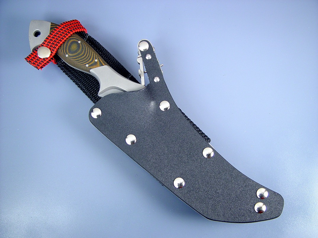 "Sirara" tactical combat knife, obverse side view in 440C high chromium stainless steel blade, 304 sculpted stainless steel bolsters, Tiger Stripe G10 fiberglass reinforced epoxy synthetic handle, locking kydex, aluminum, stainless steel sheath "Sirara" tactical combat knife, obverse side view in 440C high chromium stainless steel blade, 304 sculpted stainless steel bolsters, Tiger Stripe G10 fiberglass reinforced epoxy synthetic handle, locking kydex, aluminum, stainless steel sheath