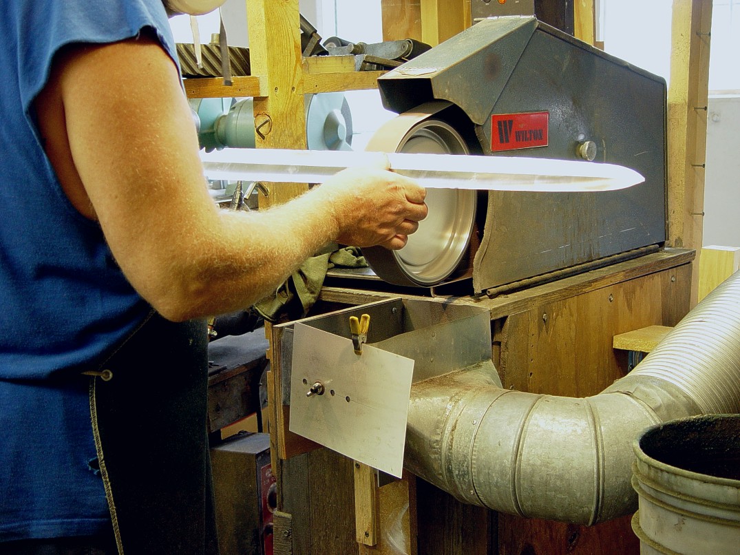Hollow grinding a sword blade offhand in high chromium martensitic high alloy tool steel Hollow grinding a sword blade offhand in high chromium martensitic high alloy tool steel
