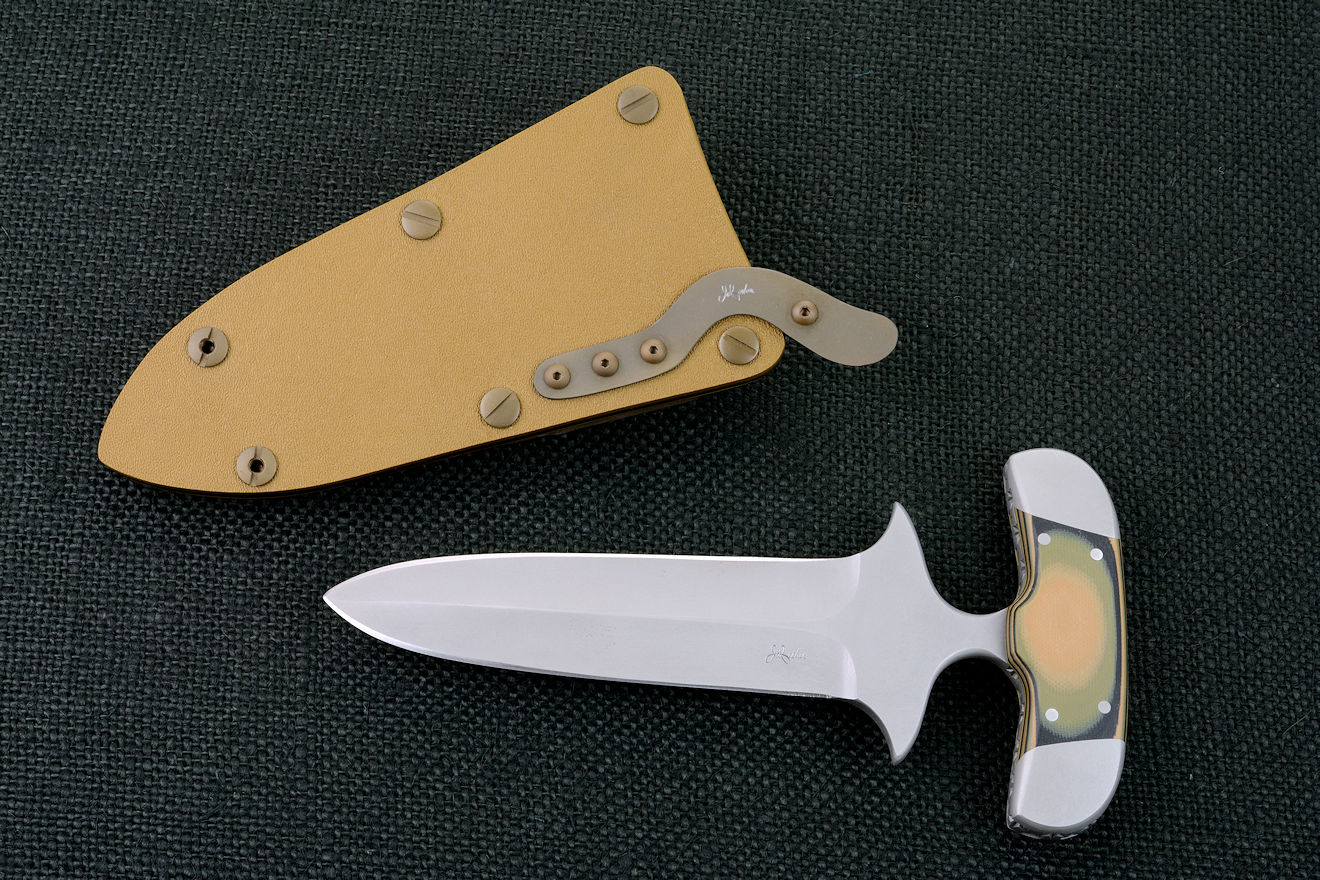 "Vindicator" Counterterrorism Tacical Combat Push/Punch dagger, obverse side view in ATS-34 high molybdenum-chromium stainless steel blade, 304 stainless steel bolsters, Camo coyote, blacck, olive drab G10 fiberglass/epoxy composite handle, hybrid tension lock sheath in coyote brown kydex, brown stainless steel, titanium, anodized brown aluminum "Vindicator" Counterterrorism Tacical Combat Push/Punch dagger, obverse side view in ATS-34 high molybdenum-chromium stainless steel blade, 304 stainless steel bolsters, Camo coyote, blacck, olive drab G10 fiberglass/epoxy composite handle, hybrid tension lock sheath in coyote brown kydex, brown stainless steel, titanium, anodized brown aluminum