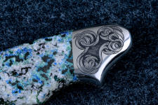 "Thuban" six power enlargement of obverse side rear bolster engraving. The interlocking grass blade pattern is backgrounded for high contrast. "Thuban" six power enlargement of obverse side rear bolster engraving. The interlocking grass blade pattern is backgrounded for high contrast.