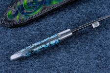 "Thuban" spine filework, edgework detail of graduated filework in nickel-carbon steel damascus blade, fully tapered tang. "Thuban" spine filework, edgework detail of graduated filework in nickel-carbon steel damascus blade, fully tapered tang.